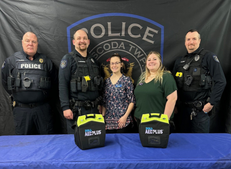 Oscoda Staff with Oscoda Police Department for donation of AED units.